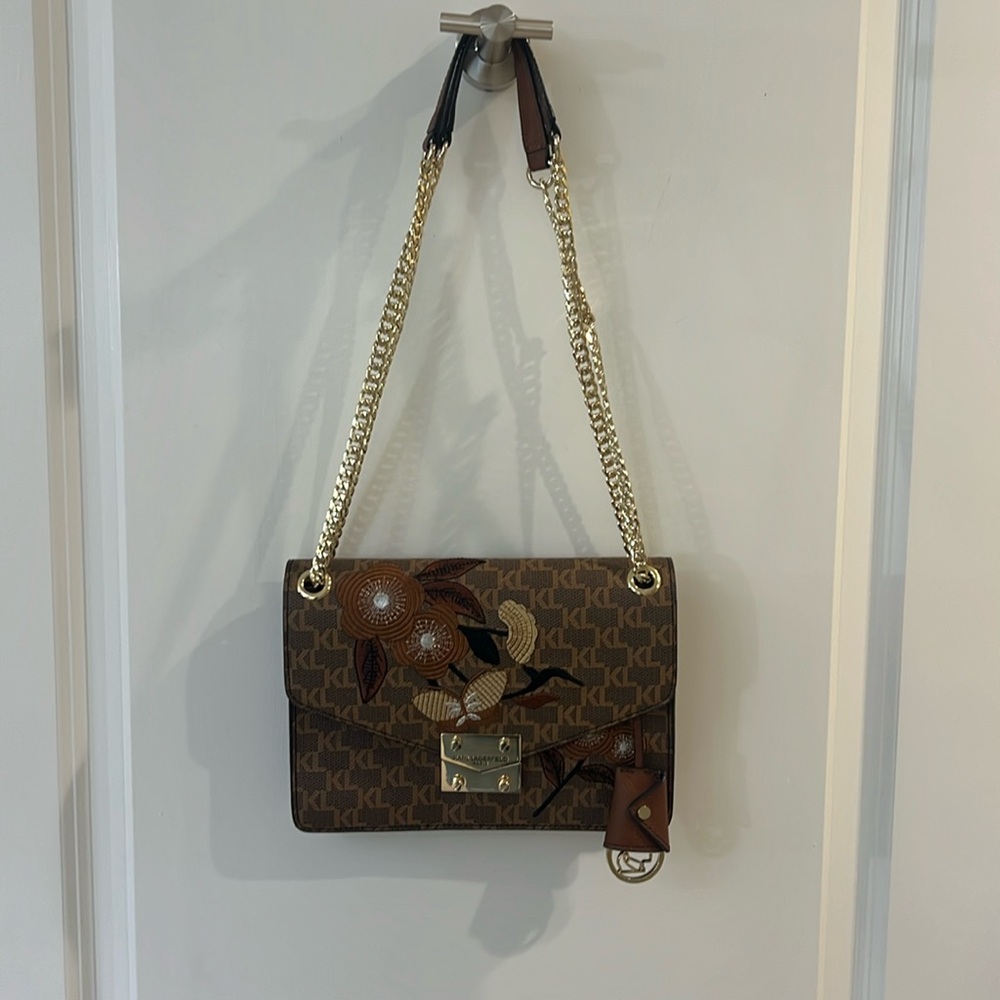 Karl lagerfeld shoulder bag /inside has three sections plus a zippered section
